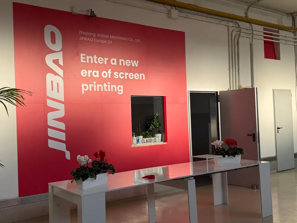 Jinbao Europe reception wall with slogan Enter a new era of screen printing in Pesaro showroom